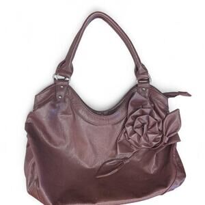 Brown leather handbag with flower